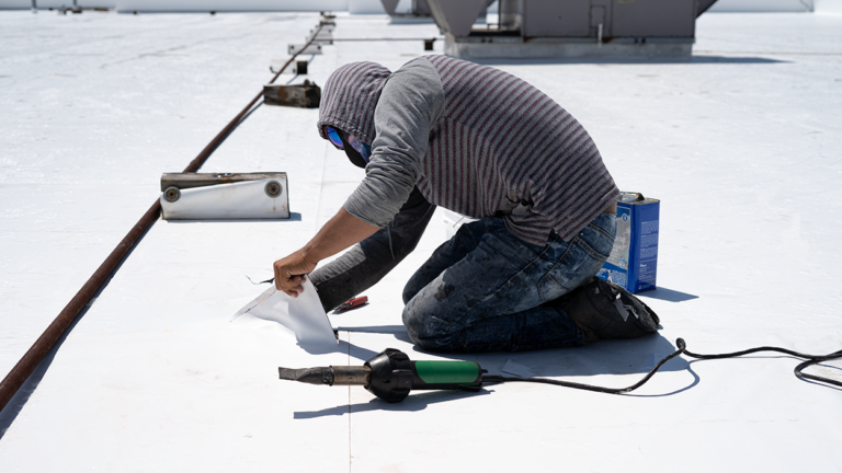 RoofConnect Roofing Contractor performing flat roof repairs on a commercial flat roof in Idaho
